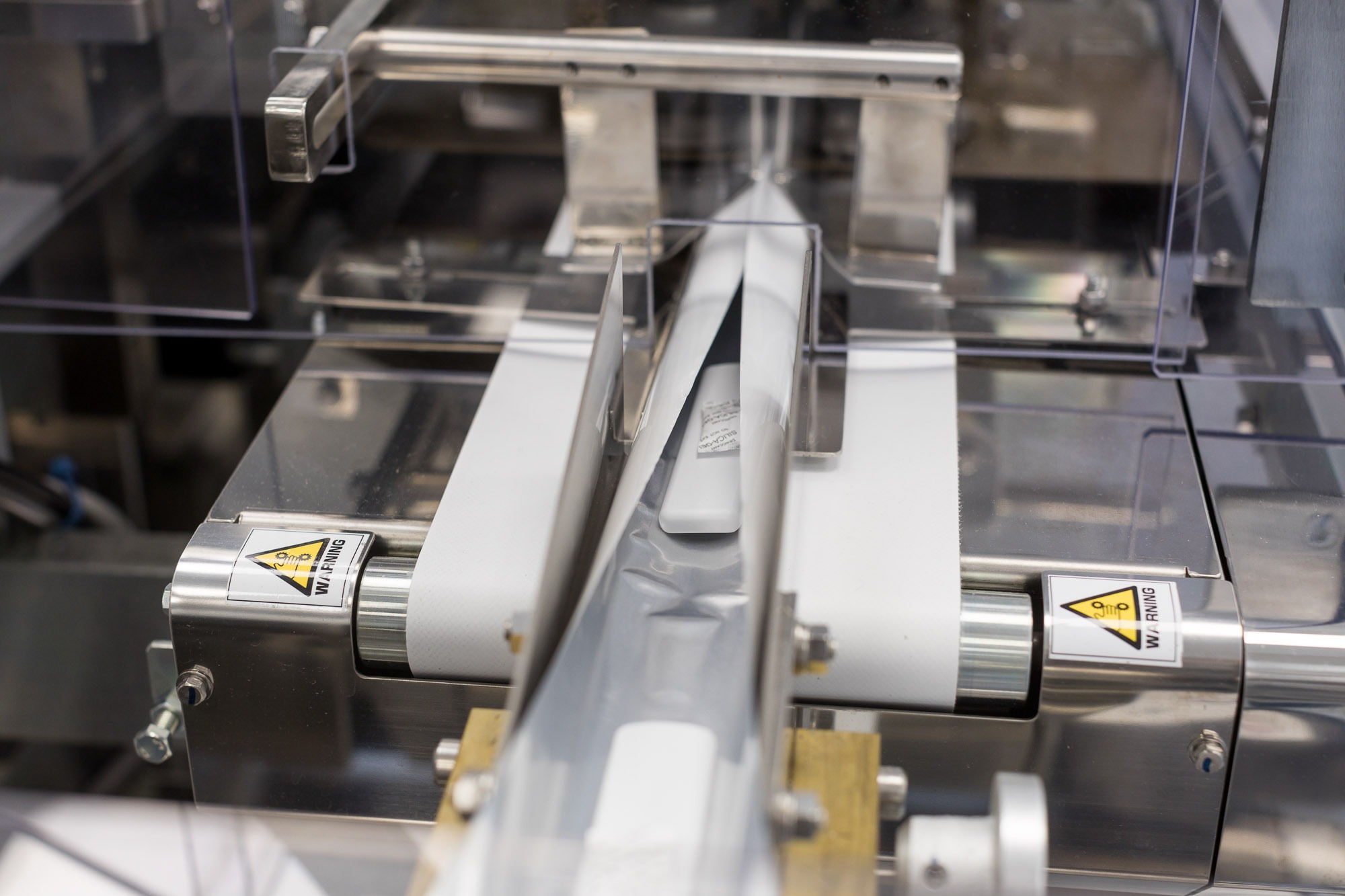 many lateral flow tests being packaged with automated machinary