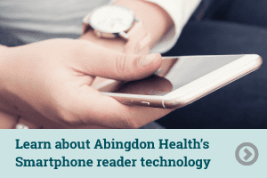 Someone using AppDx lateral flow Smartphone reader technology