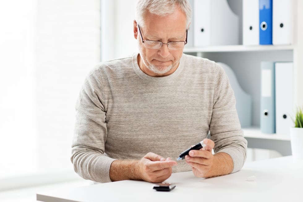 a man performing lateral flow rapid testing at home