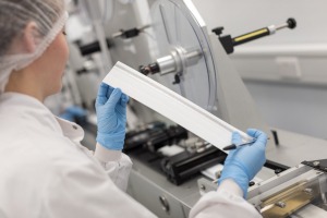 assay development scientist looking at a lateral flow test card