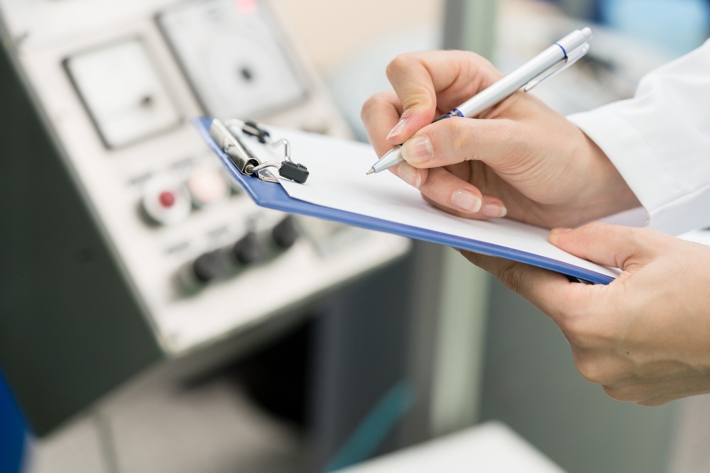 QC specialist checking lateral flow tests against QC panel